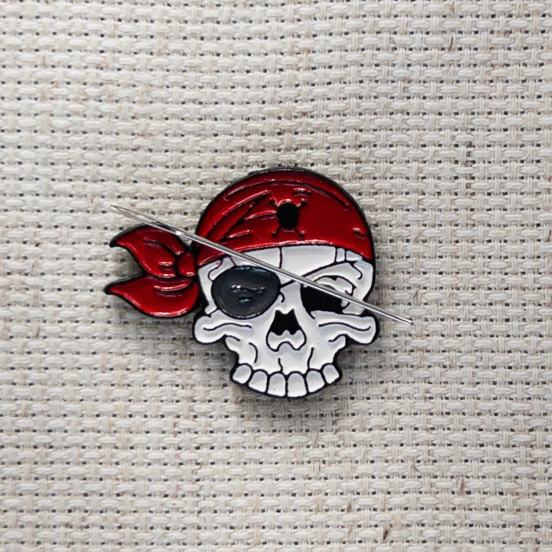 Pirate skull magnetic needle minder – enamel accessory for cross stitch, embroidery, and needlepoint – spooky nautical stitching gift for pirate lovers.