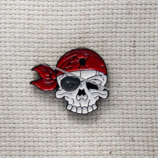 Pirate skull magnetic needle minder – enamel accessory for cross stitch, embroidery, and needlepoint – spooky nautical stitching gift for pirate lovers.