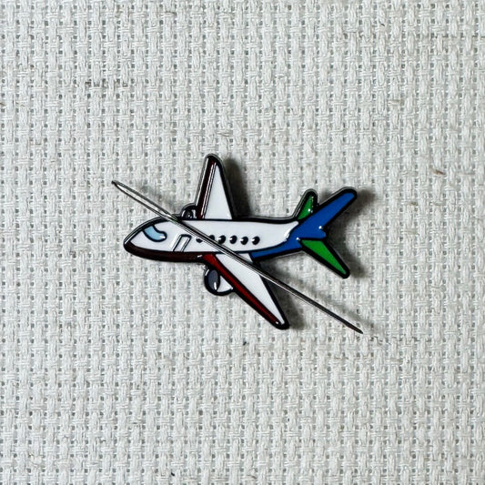 Airplane magnetic needle minder – travel themed enamel accessory for cross stitch, embroidery, and needlepoint – fun stitching gift for travelers and adventure lovers.