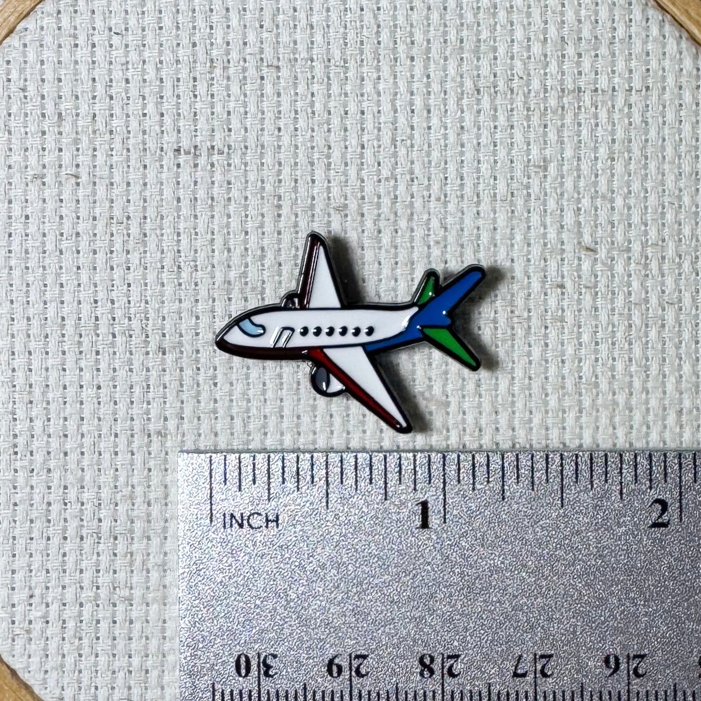 Airplane magnetic needle minder – travel themed enamel accessory for cross stitch, embroidery, and needlepoint – fun stitching gift for travelers and adventure lovers.