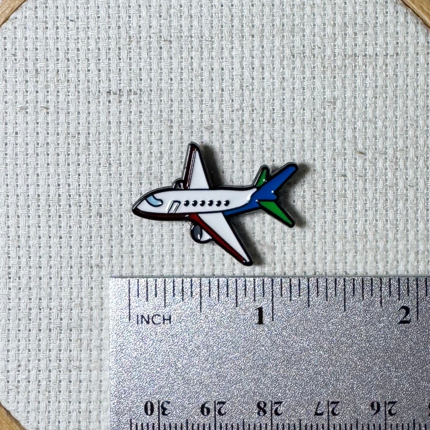 Airplane magnetic needle minder – travel themed enamel accessory for cross stitch, embroidery, and needlepoint – fun stitching gift for travelers and adventure lovers.