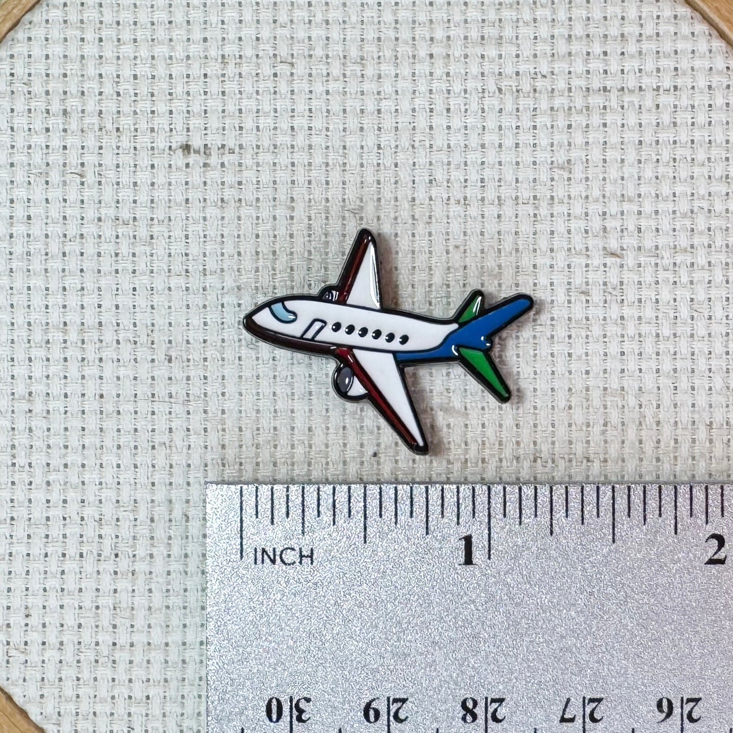 Airplane magnetic needle minder – travel themed enamel accessory for cross stitch, embroidery, and needlepoint – fun stitching gift for travelers and adventure lovers.