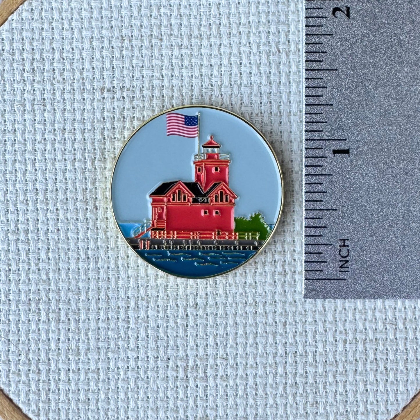 Big Red Lighthouse enamel needle minder featuring Holland, Michigan's iconic red lighthouse, magnetic needle holder for cross stitch, needlepoint, embroidery, quilting, sewing and other stitching projects.