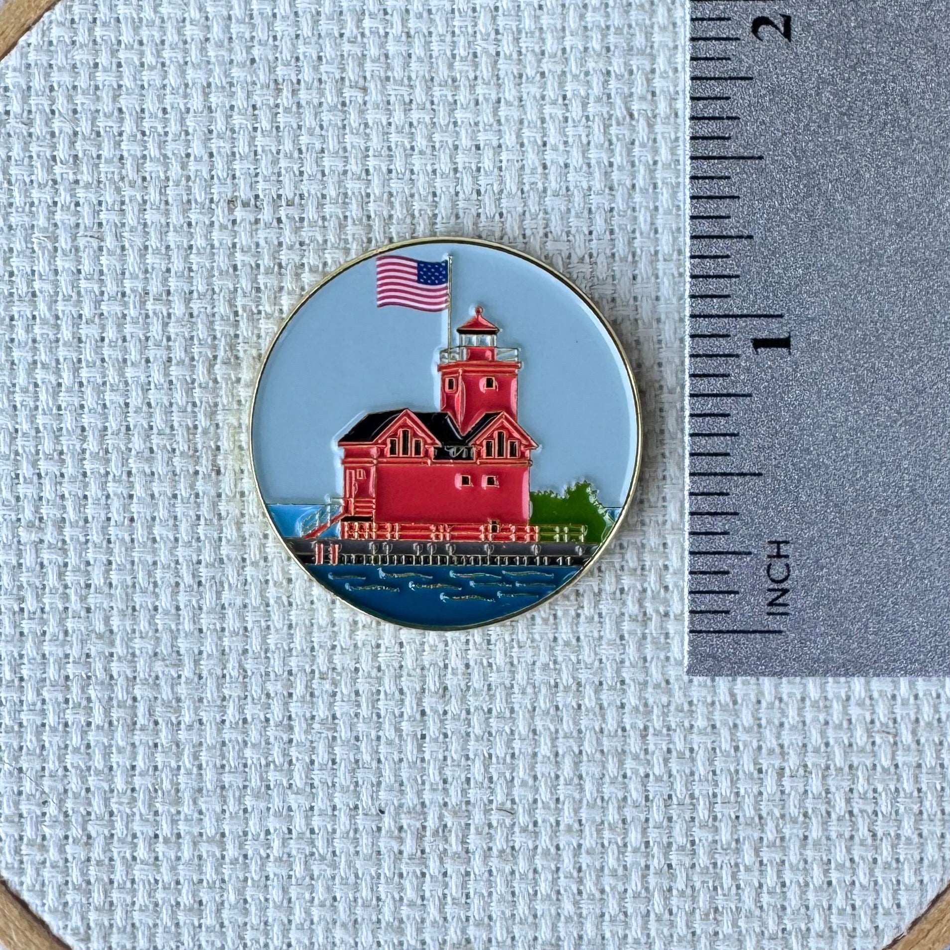 Big Red Lighthouse enamel needle minder featuring Holland, Michigan's iconic red lighthouse, magnetic needle holder for cross stitch, needlepoint, embroidery, quilting, sewing and other stitching projects.