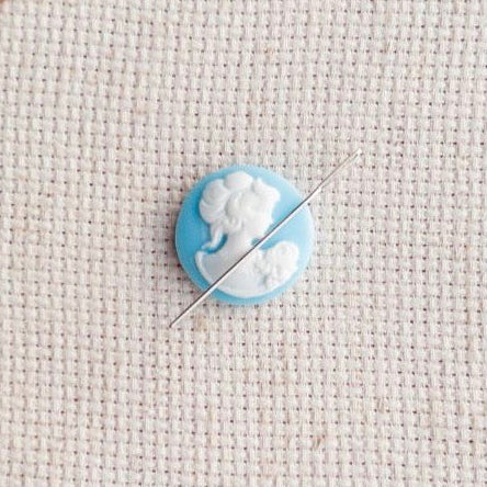 Vintage inspired blue and white cameo resin needle minder for cross stitch, needlepoint and embroidery, antique-style stitching accessory, unique resin needle minder for craft lovers, elegant sewing tool gift.