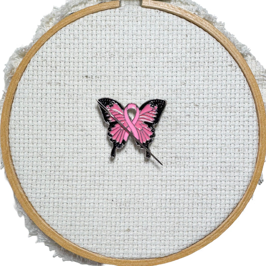 Butterfly Pink Ribbon magnetic enamel needle minder – a meaningful needle holder for cross stitch, embroidery, sewing, quilting, or needlepoint. Show your support and raise breast cancer awareness with every stitch.