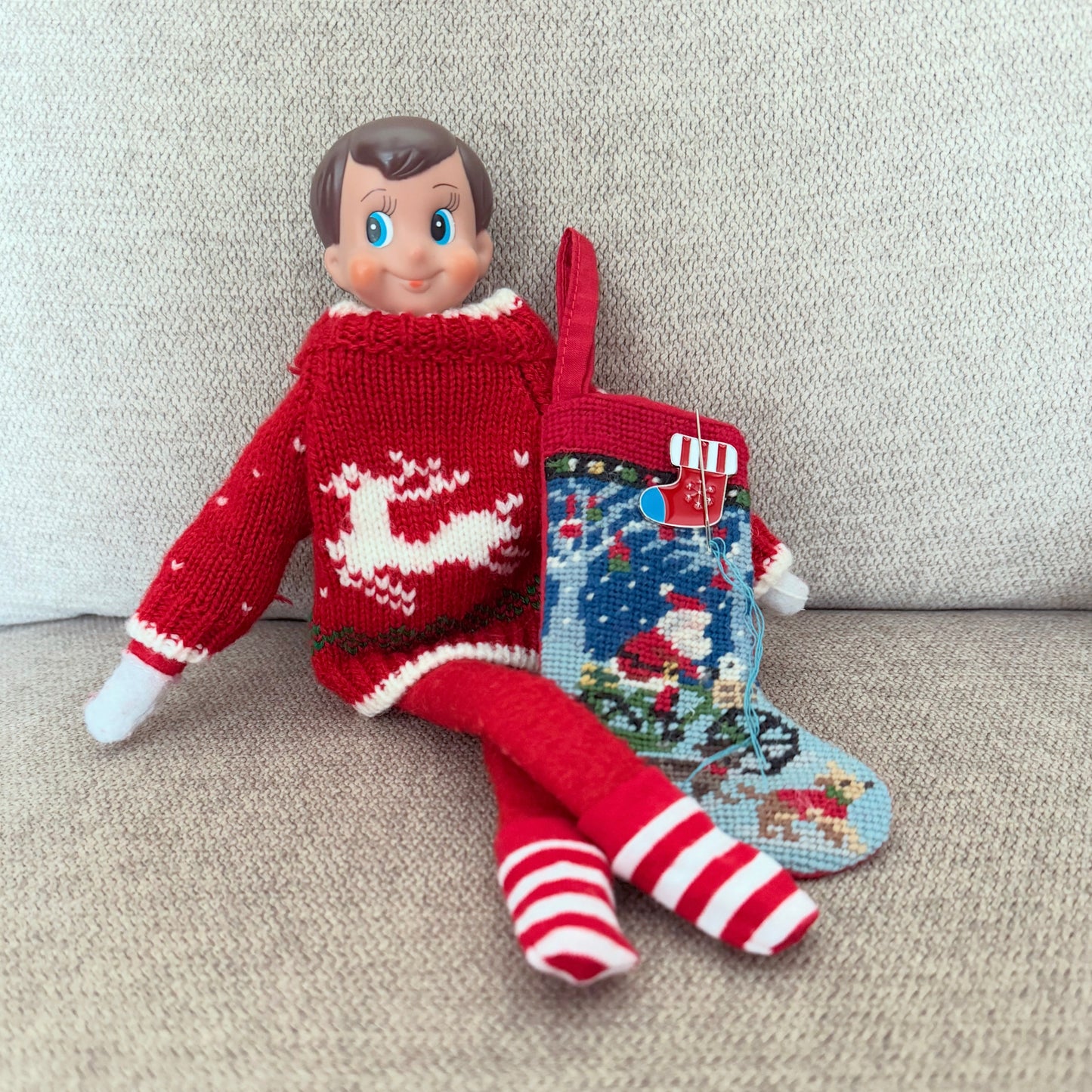 Christmas stocking magnetic needle minder – festive enamel accessory for cross stitch, embroidery, and needlepoint – holiday stitching gift with classic stocking design.