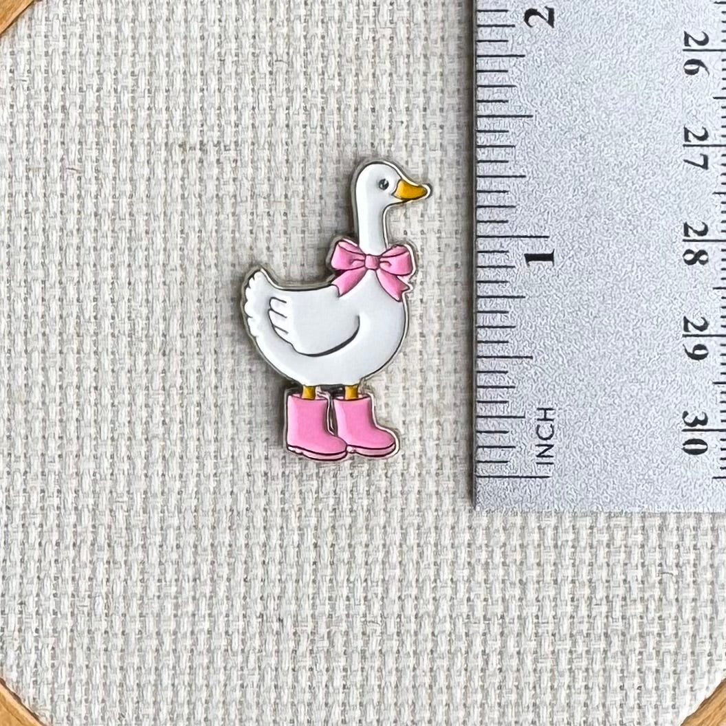 Duck with Pink Boots needle minder shown with ruler for size reference, approximately 1.25 inch needle minder.
