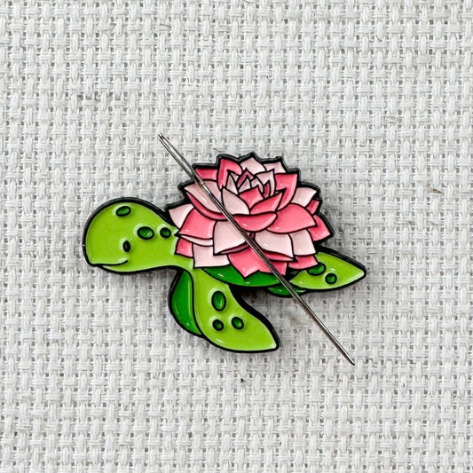 Floral turtle magnetic needle minder – cute enamel accessory with turtle and flowers for cross stitch, embroidery, and needlepoint – ocean and nature themed stitching gift.