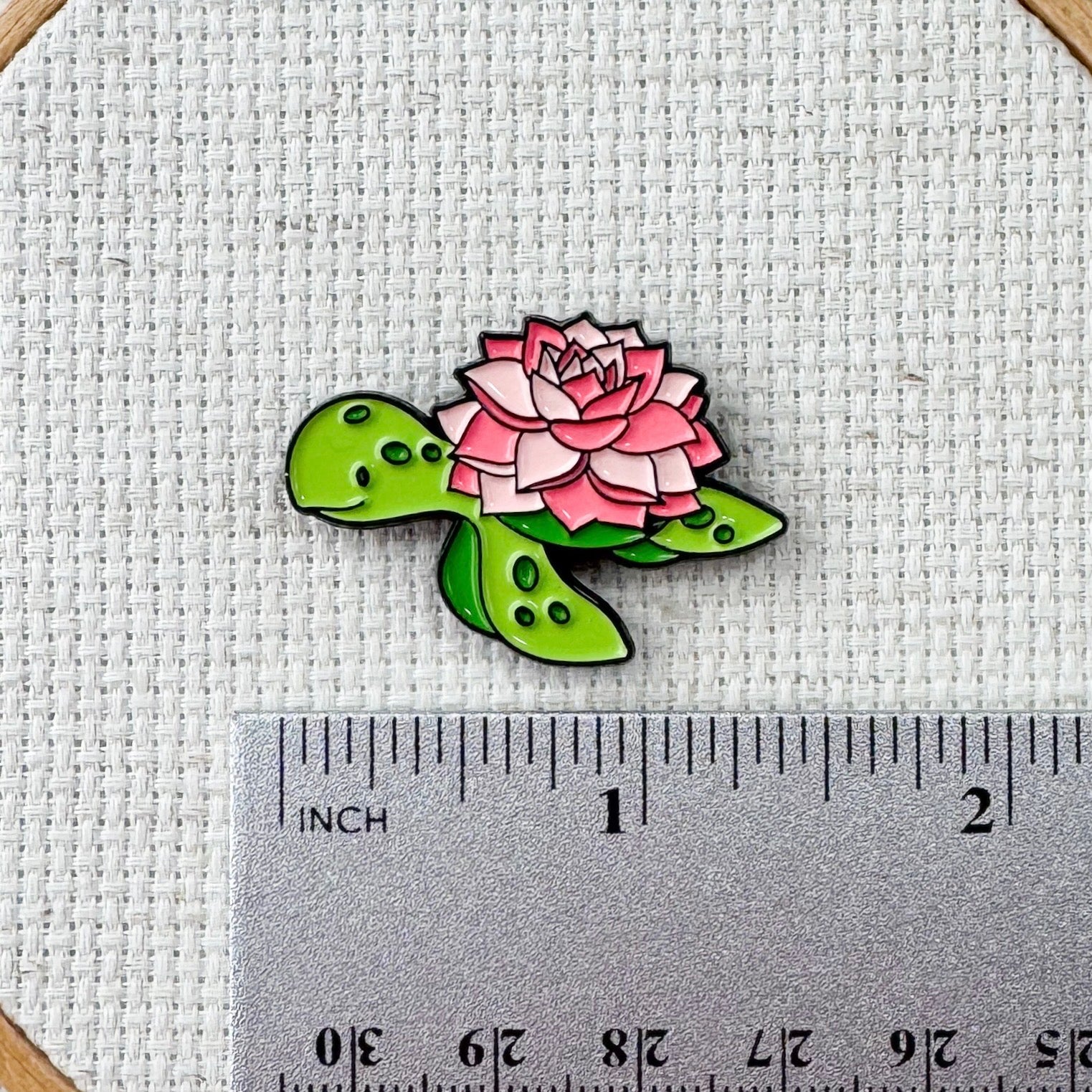 Floral turtle magnetic needle minder – cute enamel accessory with turtle and flowers for cross stitch, embroidery, and needlepoint – ocean and nature themed stitching gift.