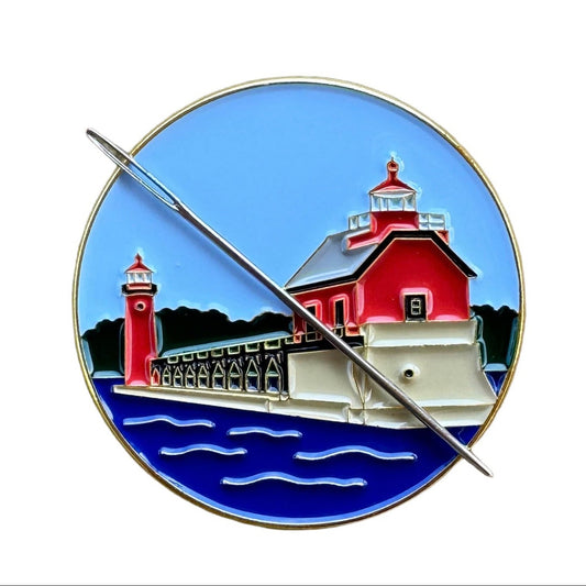 Grand Haven Lighthouse enamel needle minder inspired by the iconic red lighthouses on Lake Michigan, magnetic accessory for cross stitch, needlepoint, embroidery, quilting and sewing.