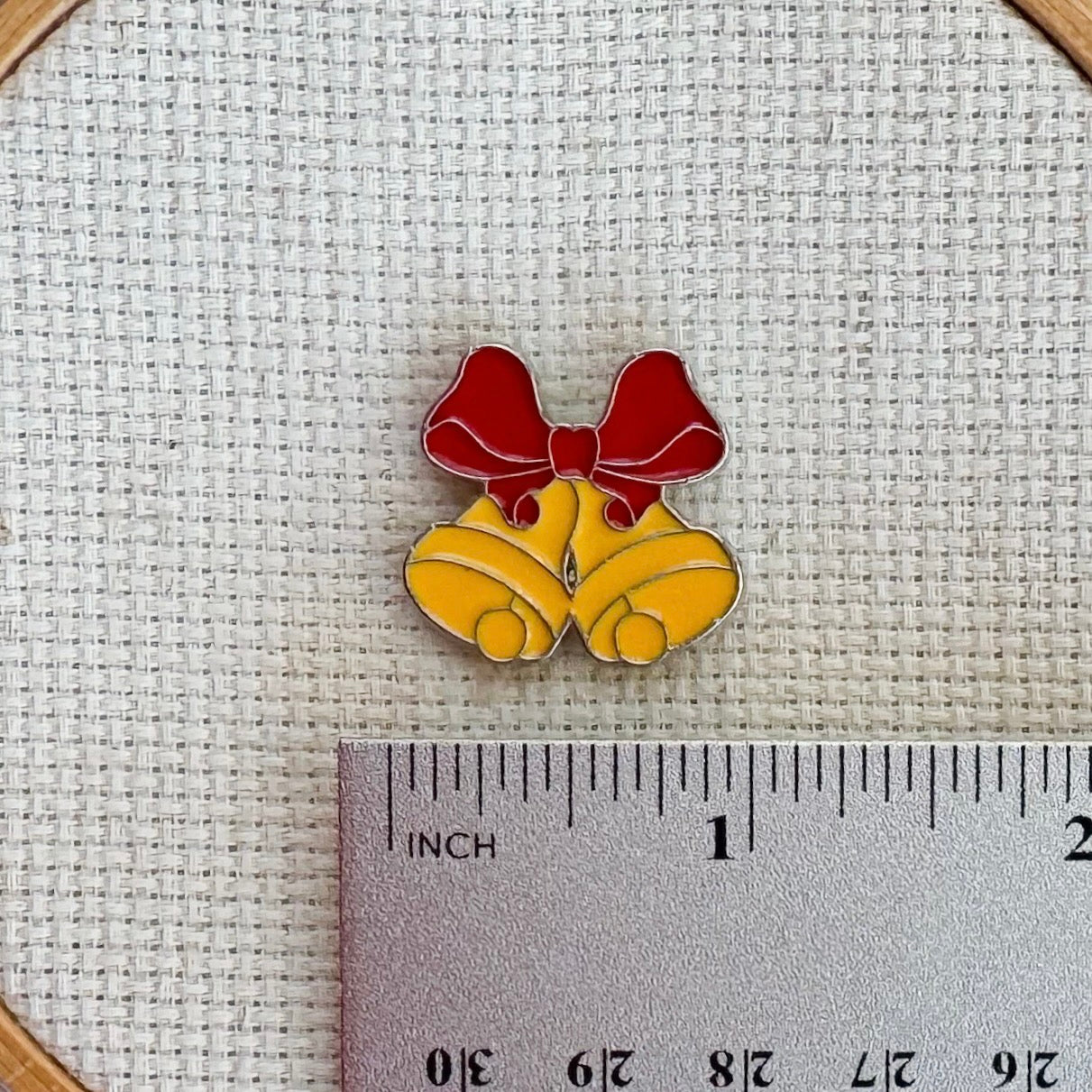 Christmas bells magnetic needle minder – festive enamel accessory for cross stitch, embroidery, and needlepoint – holiday stitching gift with classic jingle bell design.