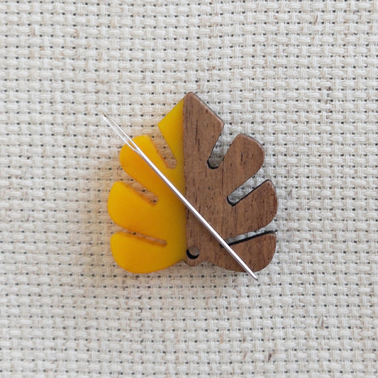 Autumn leaf magnetic needle minder made of wood and yellow resin accessory for cross stitch, embroidery, and needlepoint – fall stitching gift.