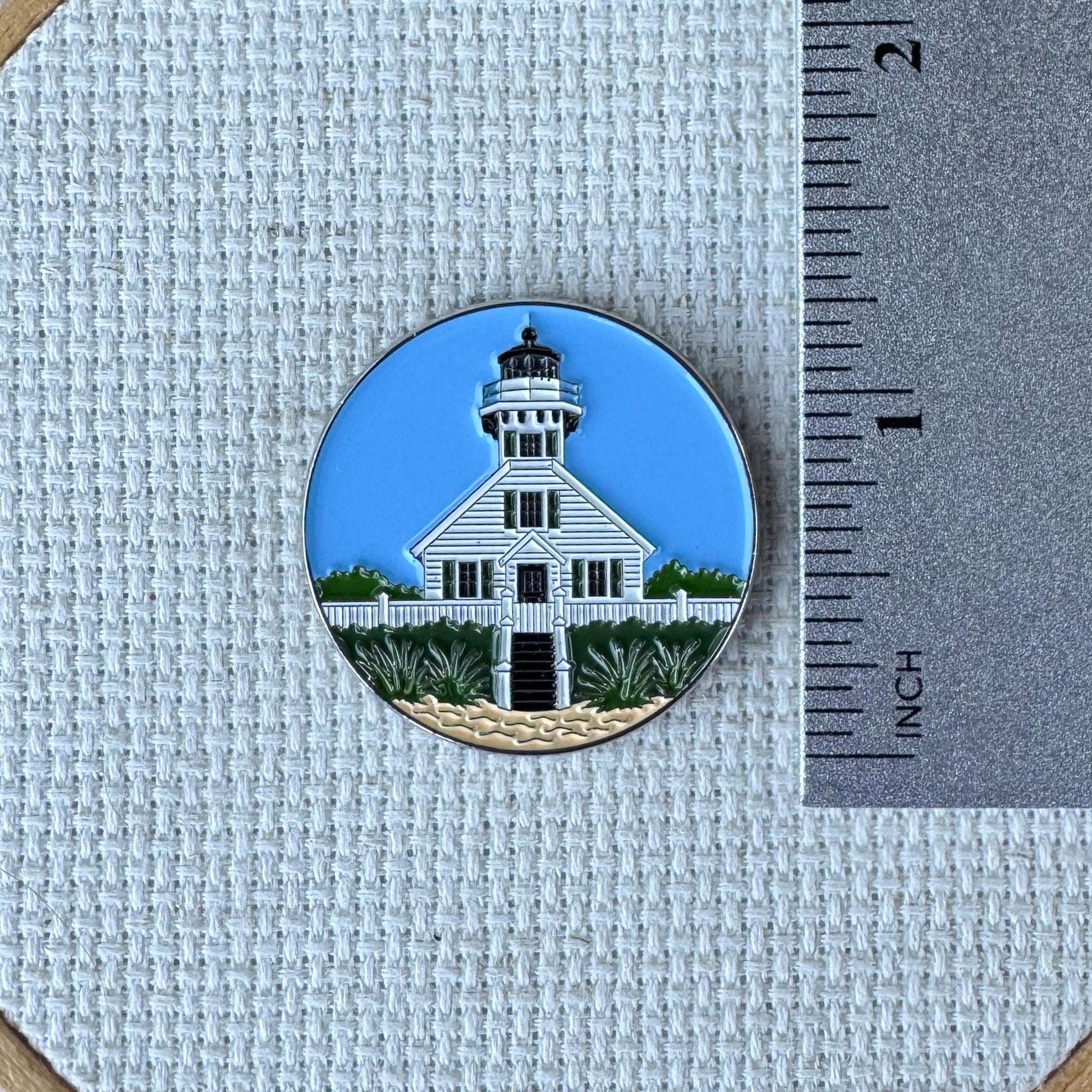 Mission Point Lighthouse magnetic enamel needle minder inspired by the iconic Traverse City, Michigan landmark, perfect for cross stitch, needlepoint, embroidery, quilting and sewing.