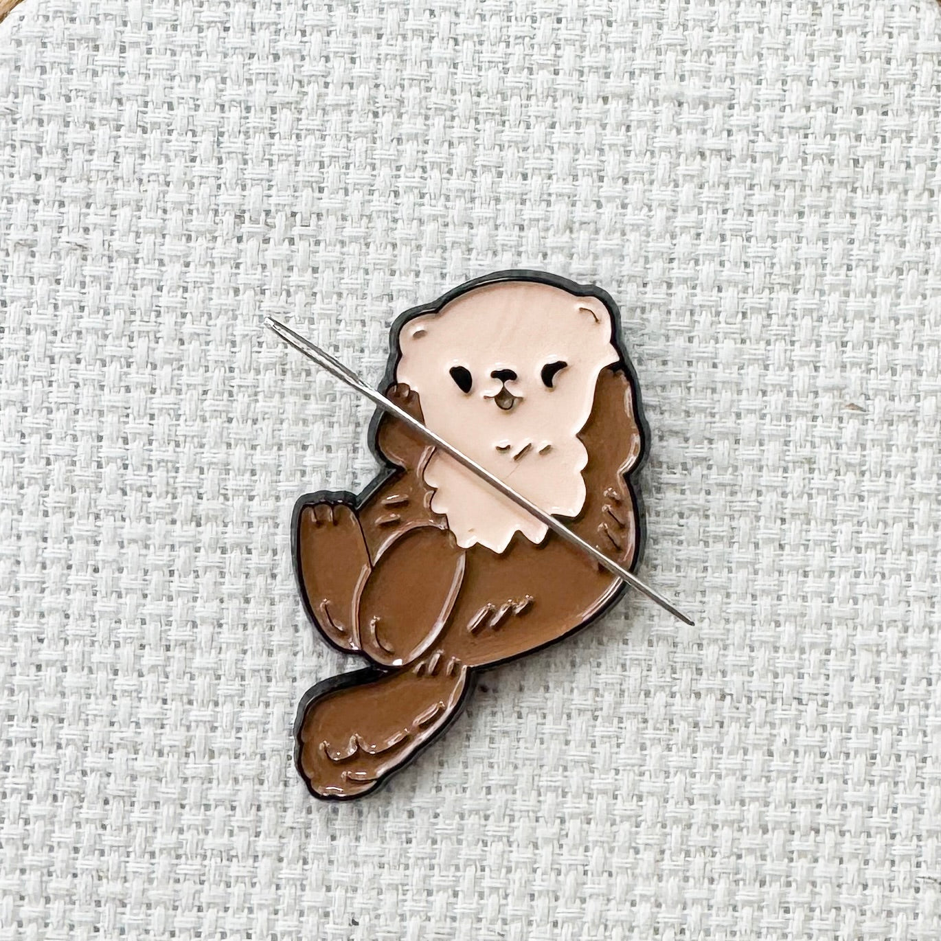 Brown otter magnetic needle minder – woodland animal enamel accessory for cross stitch, embroidery, and needlepoint – cute stitching gift for nature and wildlife lovers.