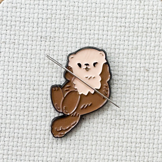 Brown otter magnetic needle minder – woodland animal enamel accessory for cross stitch, embroidery, and needlepoint – cute stitching gift for nature and wildlife lovers.