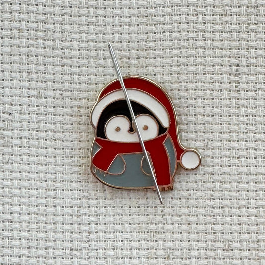 Penguin in Santa hat magnetic needle minder – cute enamel accessory for cross stitch, embroidery, and needlepoint – festive winter stitching gift for holiday crafters.