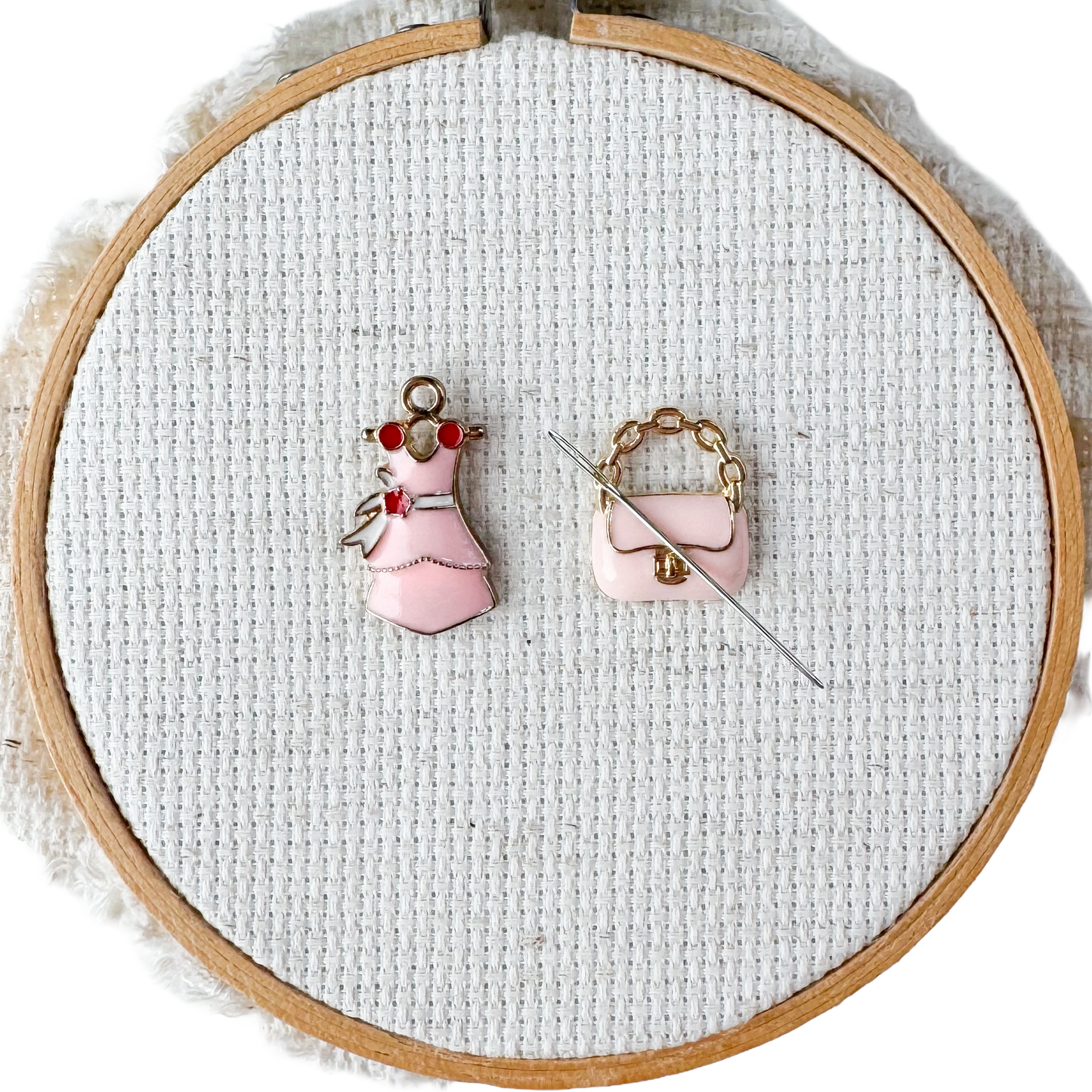 Pink dress and matching purse magnetic needle minders – enamel accessory for cross stitch, embroidery, and needlepoint – stylish handbag design for fashion loving stitchers.