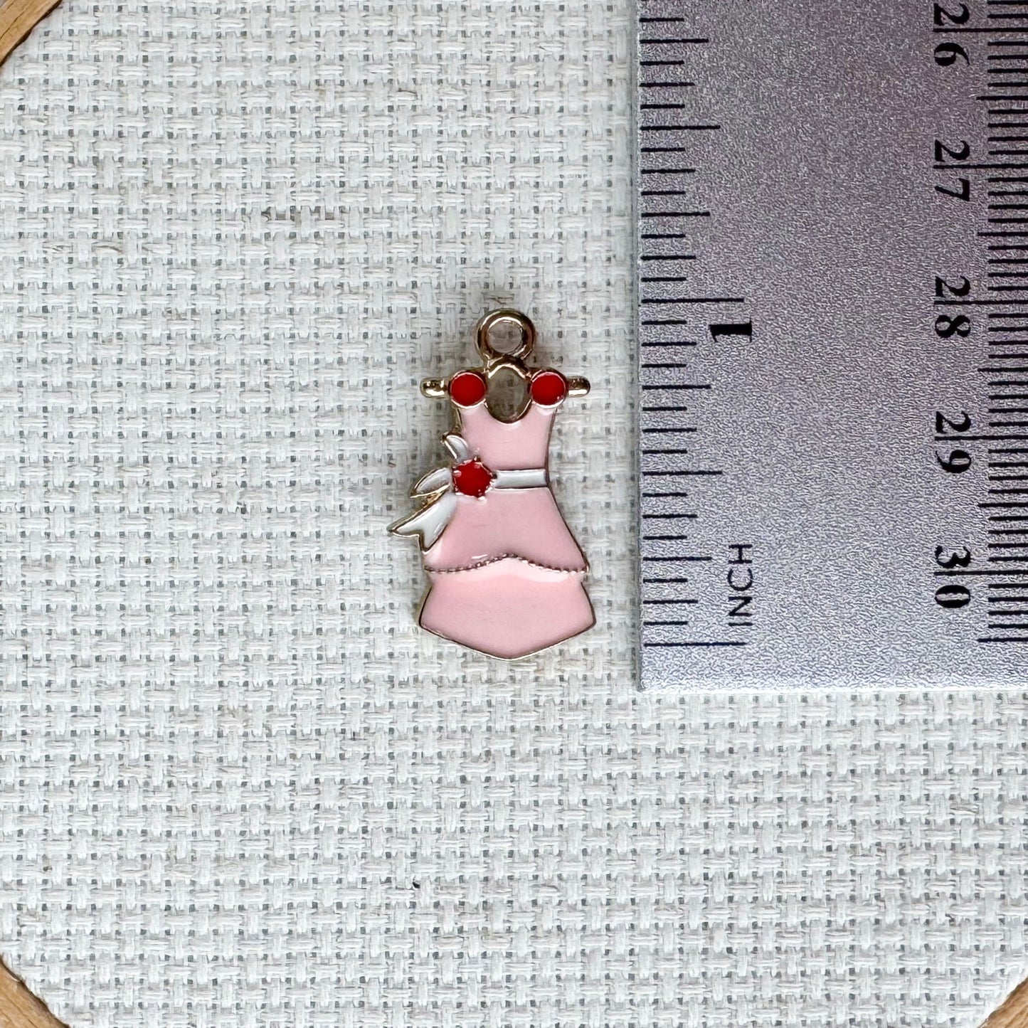Pretty pink dress magnetic needle minder – enamel accessory for cross stitch, embroidery, and needlepoint – feminine stitching gift for dressmakers and crafters.