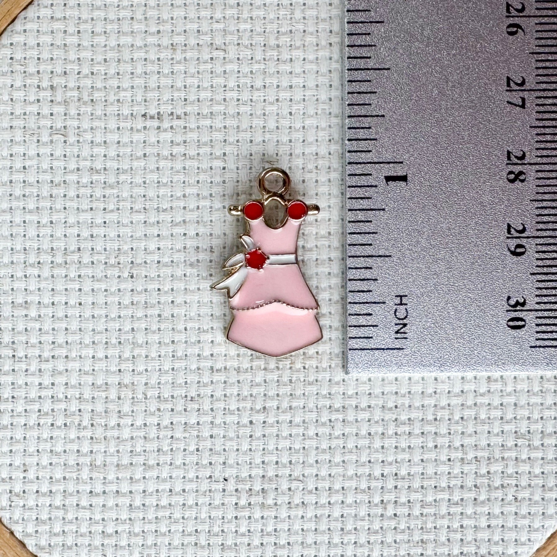Pretty pink dress magnetic needle minder – enamel accessory for cross stitch, embroidery, and needlepoint – feminine stitching gift for dressmakers and crafters.