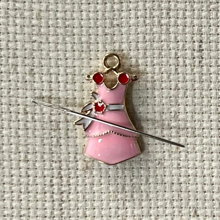 Pretty pink dress magnetic needle minder – enamel accessory for cross stitch, embroidery, and needlepoint – feminine stitching gift for dressmakers and crafters.