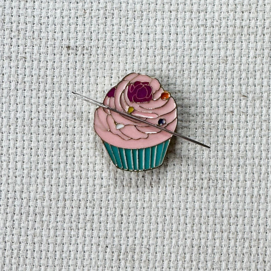Pink cupcake magnetic needle minder – sweet enamel accessory for cross stitch, embroidery, and needlepoint – cute dessert themed stitching gift for bakers and cupcake lovers.