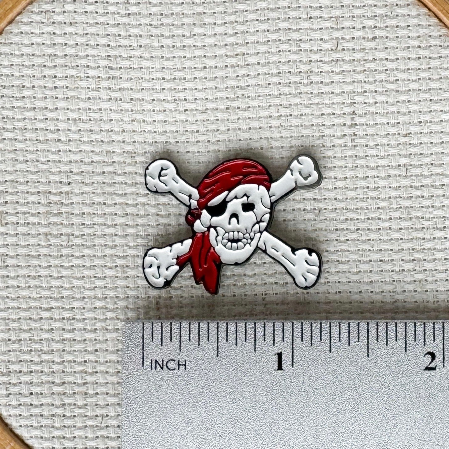 Pirate skull magnetic needle minder – enamel accessory for cross stitch, embroidery, and needlepoint – spooky nautical stitching gift for pirate lovers.