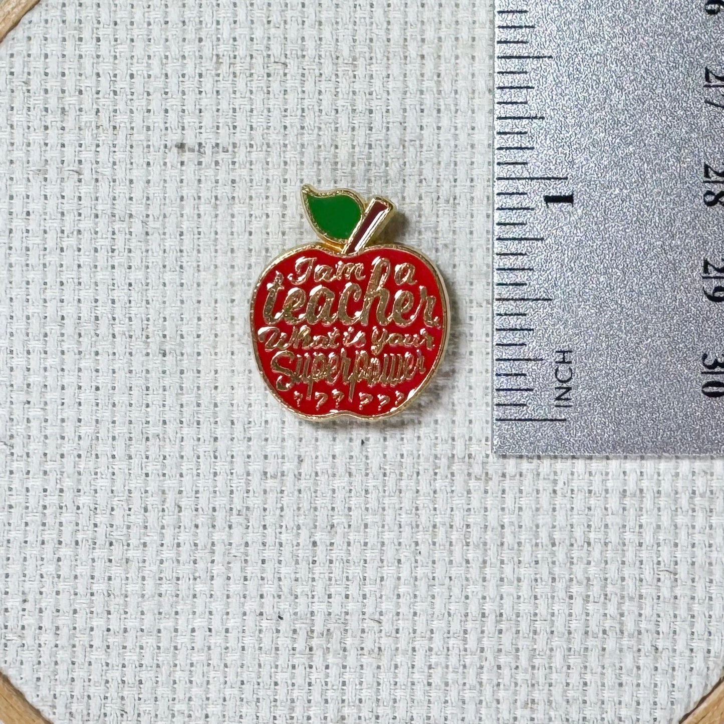 Red teacher apple magnetic enamel needle minder. Cute enamel accessory for cross stitch, embroidery, knitting, crocheting, sewing and needlepoint.