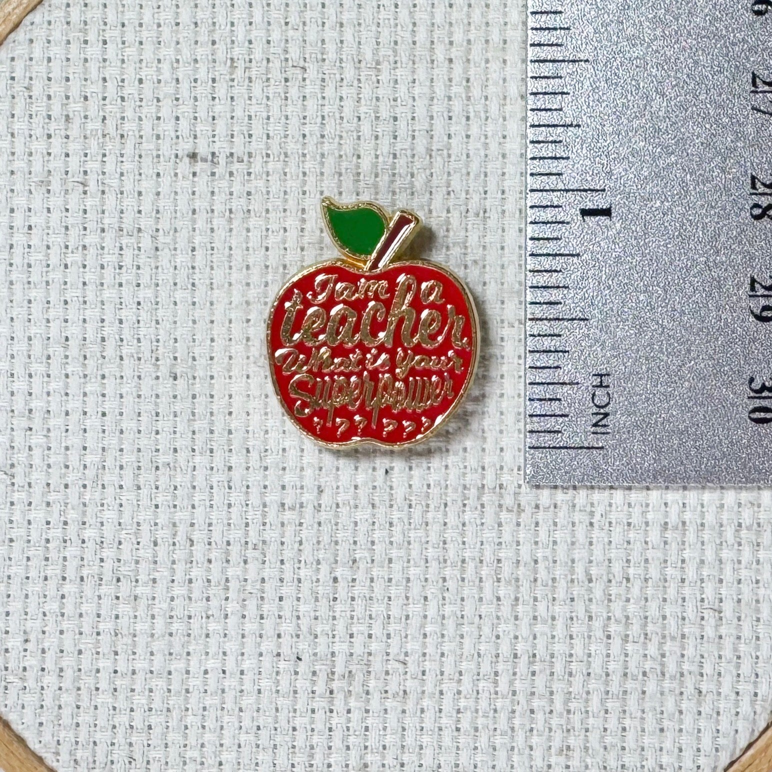 Red teacher apple magnetic enamel needle minder. Cute enamel accessory for cross stitch, embroidery, knitting, crocheting, sewing and needlepoint.