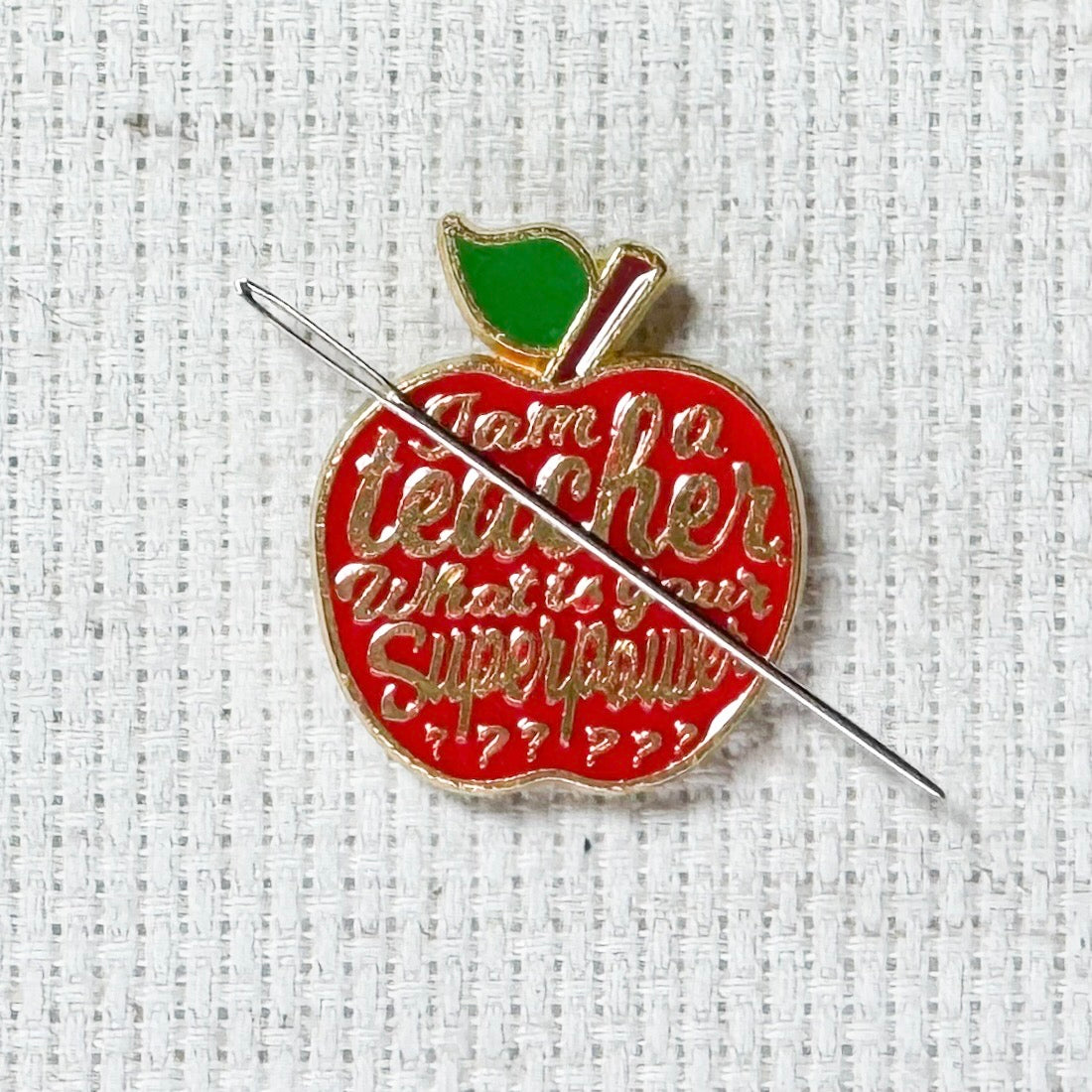 Red teacher apple magnetic enamel needle minder. Cute enamel accessory for cross stitch, embroidery, knitting, crocheting, sewing and needlepoint.