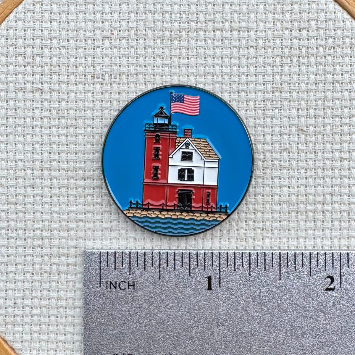 Round Island Lighthouse needle minder shown with ruler for size measurement, approximately 1.25 inch.