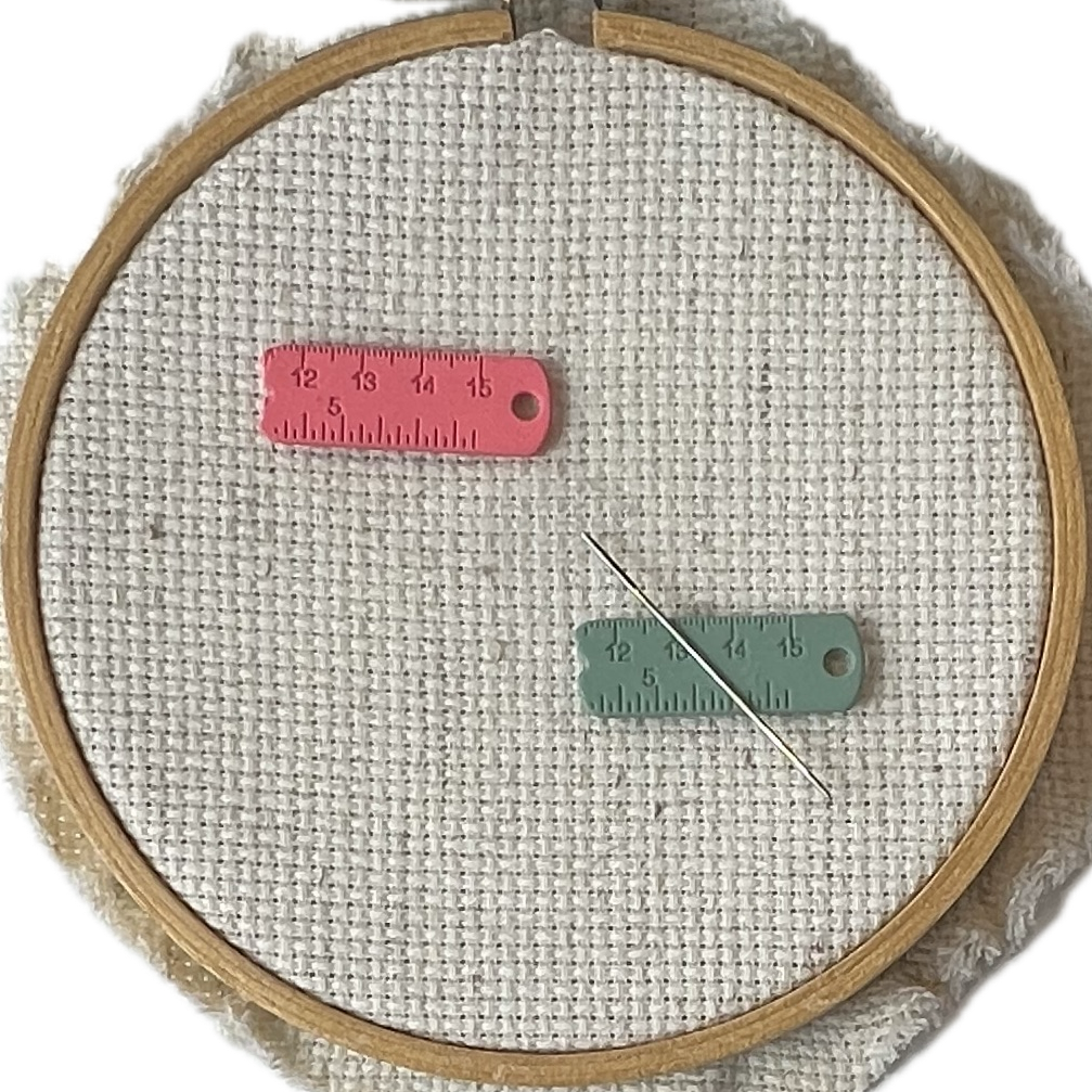 Set of 2 pink and green enamel measuring tape needle minder for cross stitch, embroidery, quilting, needlepoint, crewel, tapestry, and sewing, magnetic stitching accessory, cute pink craft tool for knitters and crocheters, durable enamel needle minder gift.