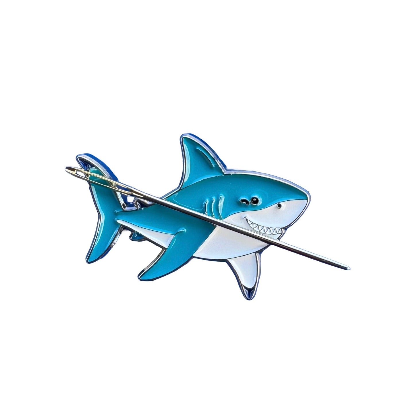 Close up of shark enamel needle minder with hard enamel finish and metal edging.