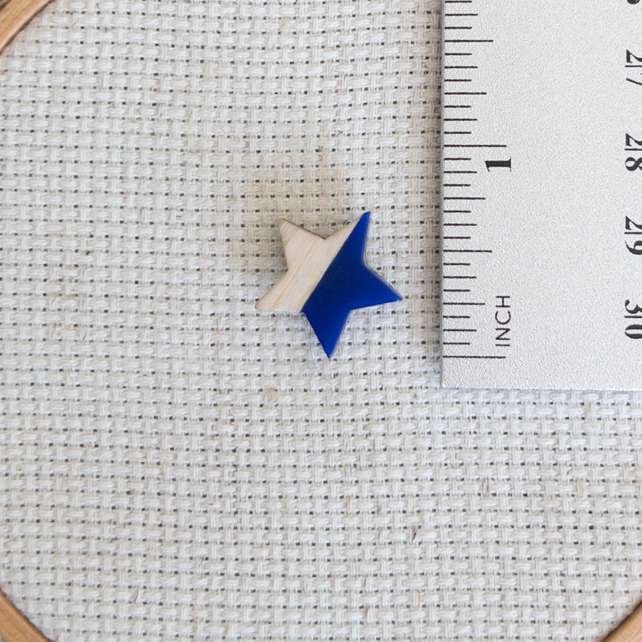 Star shaped magnetic needle minder with blue resin and natural wood – ideal for cross stitch, embroidery, needlepoint, quilting, and hand sewing. A unique and functional needle holder for stitchers and crafters.