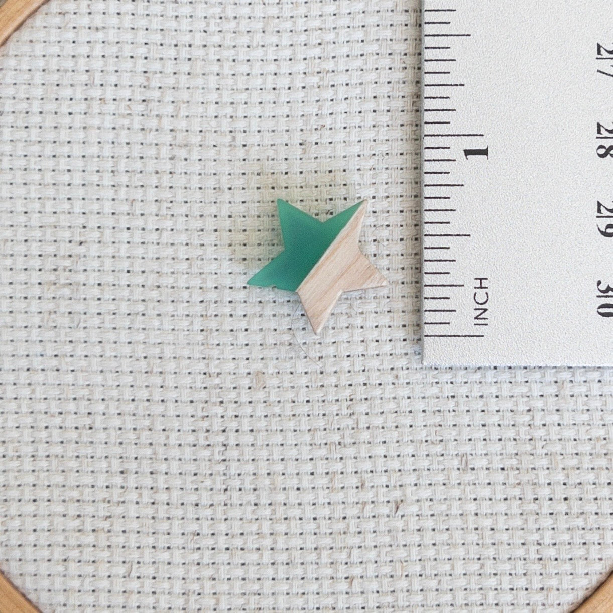 Star shaped magnetic needle minder with green resin and natural wood – ideal for cross stitch, embroidery, needlepoint, quilting, and hand sewing. A unique and functional needle holder for stitchers and crafters.