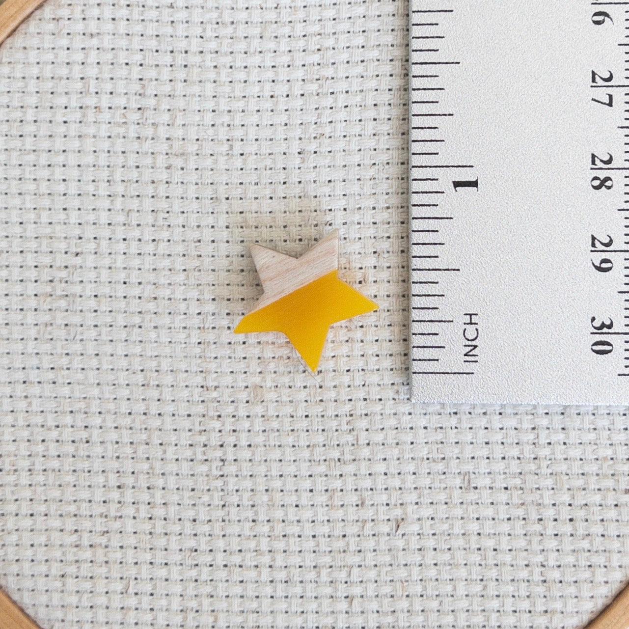 Star shaped magnetic needle minder with yellow resin and natural wood – ideal for cross stitch, embroidery, needlepoint, quilting, and hand sewing. A unique and functional needle holder for stitchers and crafters.