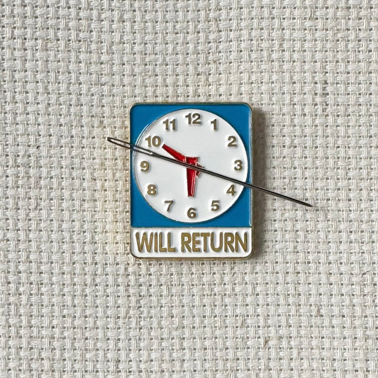 Will Return clock sign magnetic enamel needle minder – a fun and nostalgic stitching accessory for cross stitch, embroidery, sewing, quilting, or needlepoint. Perfect for adding a touch of retro charm to your project.