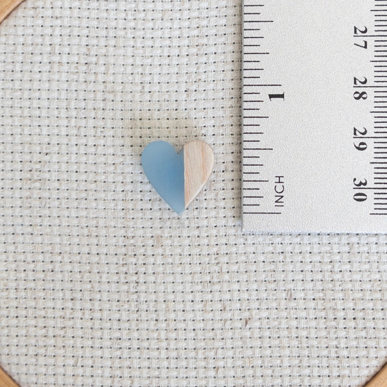 Heart shaped magnetic needle minder with blue resin and brown wood – perfect for cross stitch, embroidery, needlepoint, quilting, and hand sewing. A unique and functional needle holder for stitchers and crafters.