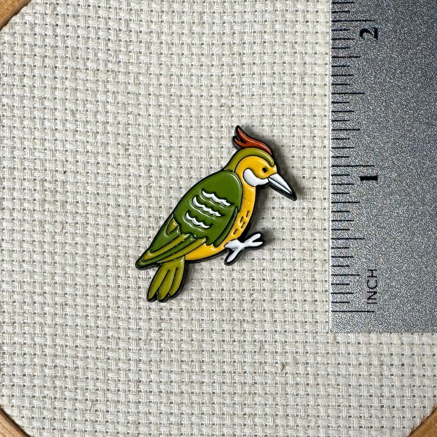 Woodpecker magnetic enamel needle minder – vibrant needle holder for cross stitch, embroidery, sewing, quilting, or needlepoint. A great pick for nature lovers and birdwatching stitchers.