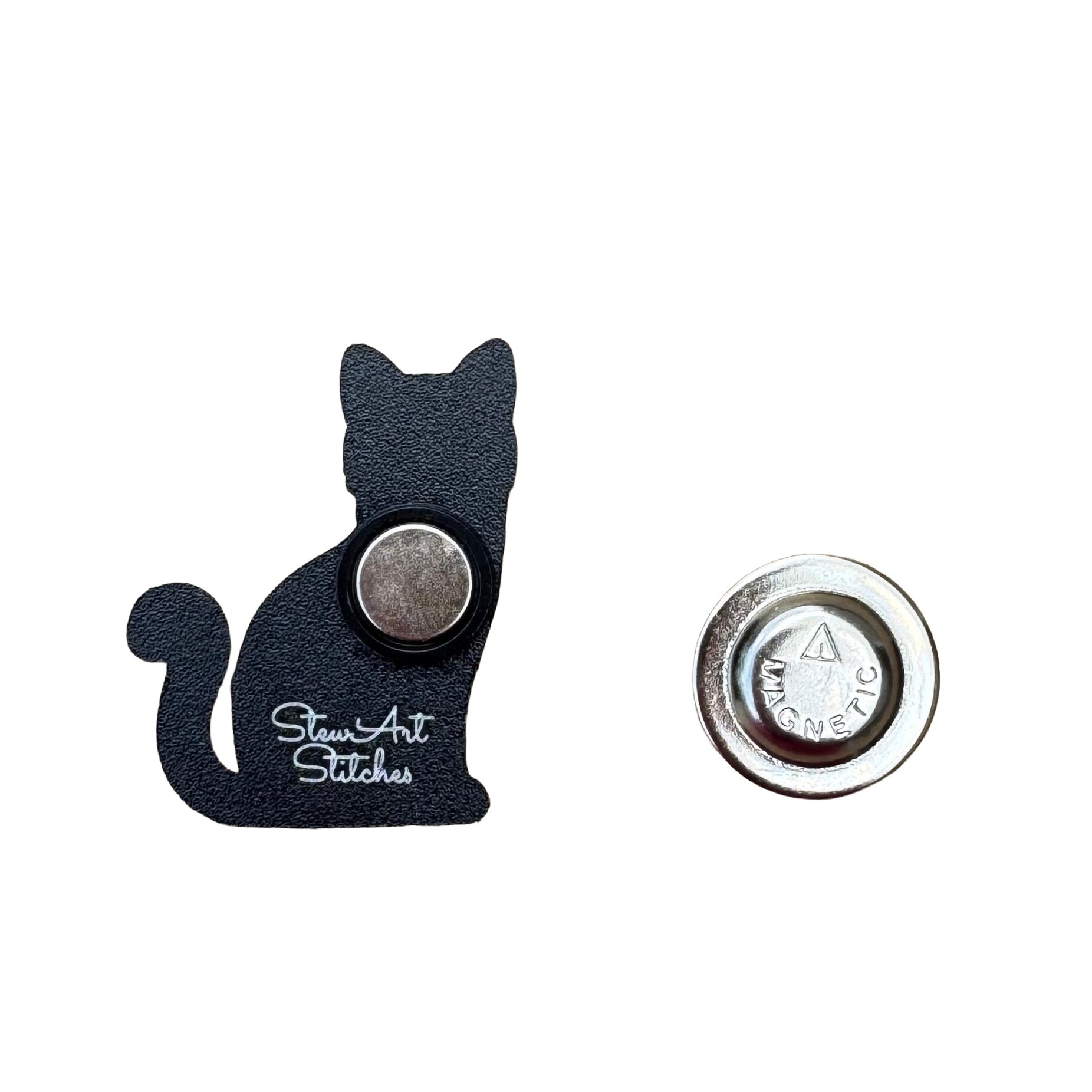 Back of black cat needle minder showing strong magnetic backing.