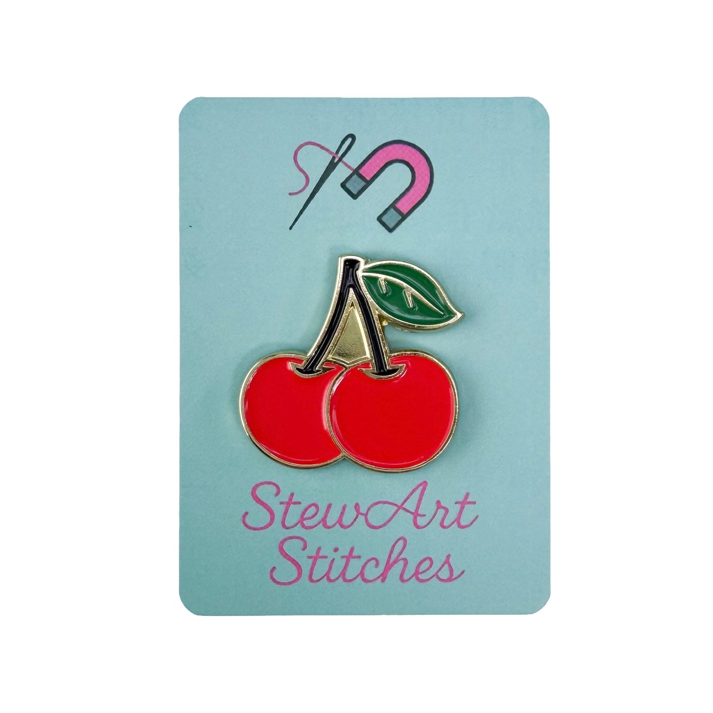 Red cherry needle minder with strong magnet for stitching.