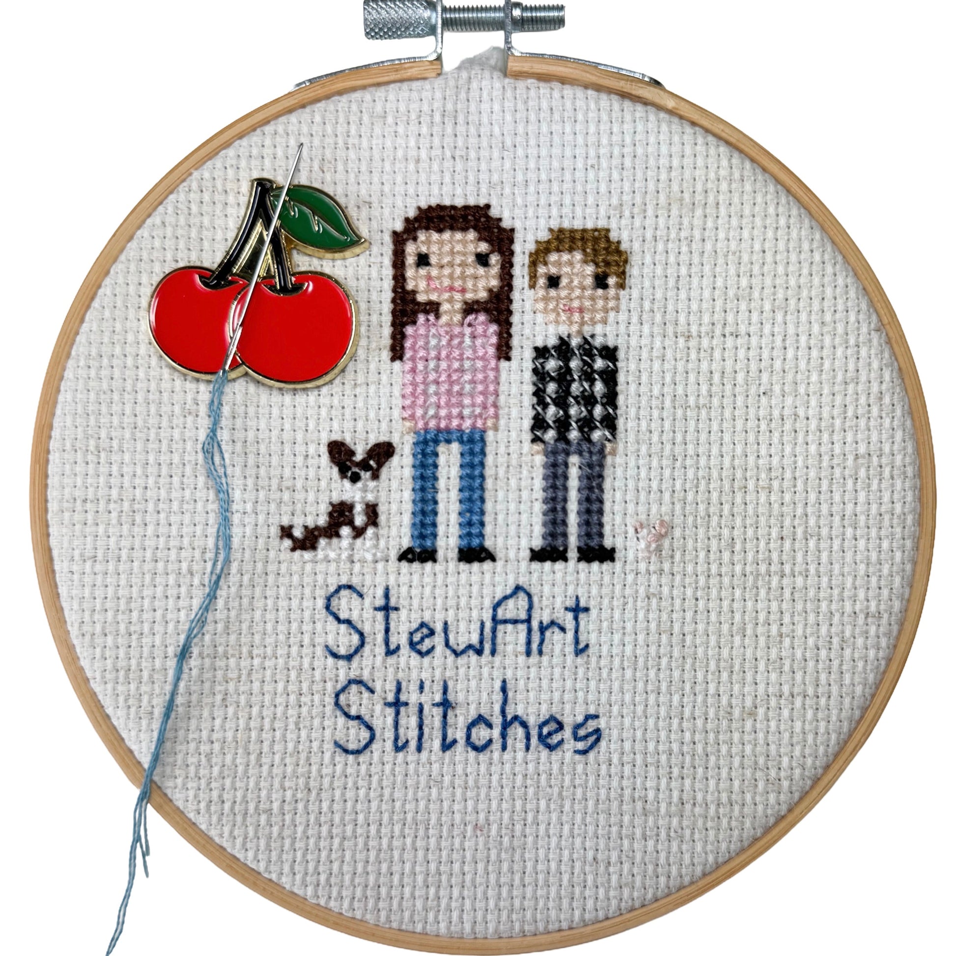 Red cherry needle minder with strong magnet for stitching.