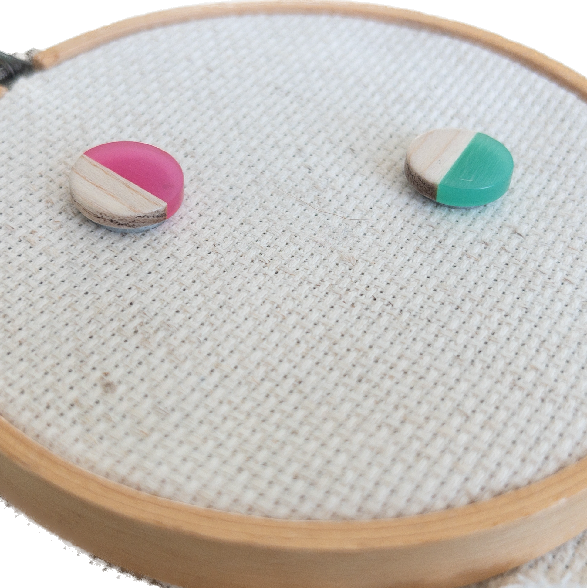 set of 2 circle shaped magnetic needle minders with pink and green resin and natural wood – perfect for cross stitch, embroidery, needlepoint, quilting, and hand sewing. A unique and functional needle holder for stitchers and crafters.