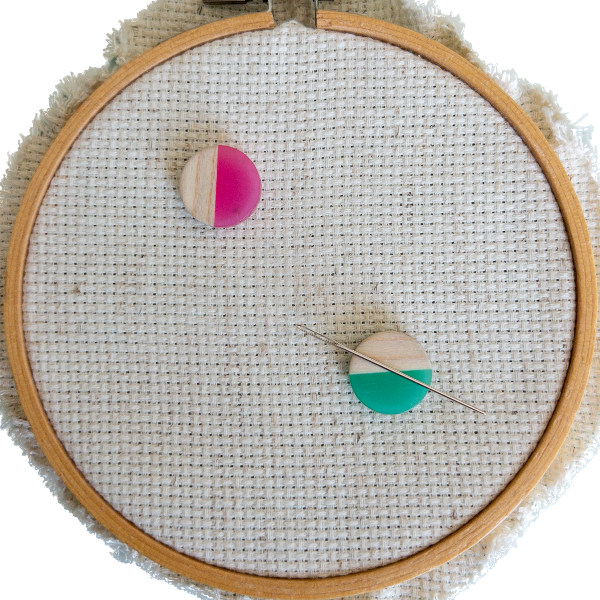Set of 2 circle shaped magnetic needle minders with pink and green resin and natural wood – perfect for cross stitch, embroidery, needlepoint, quilting, and hand sewing. A unique and functional needle holder for stitchers and crafters.