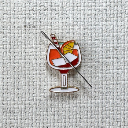 Colorful cocktail enamel needle minder with strong magnet, perfect for holding needles while cross stitching, embroidery, quilting, needlepoint or sewing. Fun drink-themed needle holder for stitchers.