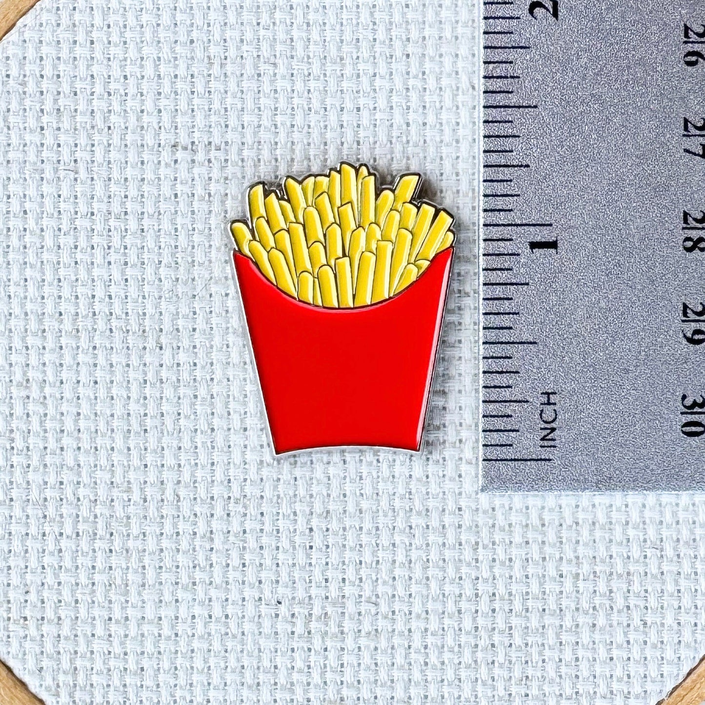 Red carton of French fries enamel needle minder with magnetic back for cross stitch, needlepoint, embroidery, quilting and sewing.