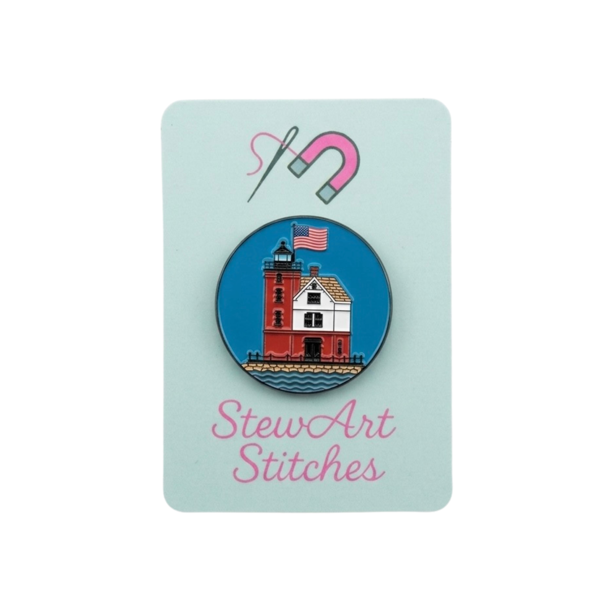 Round Island lighthouse magnetic enamel needle minder displayed on product packaging card for StewArt Stitches.