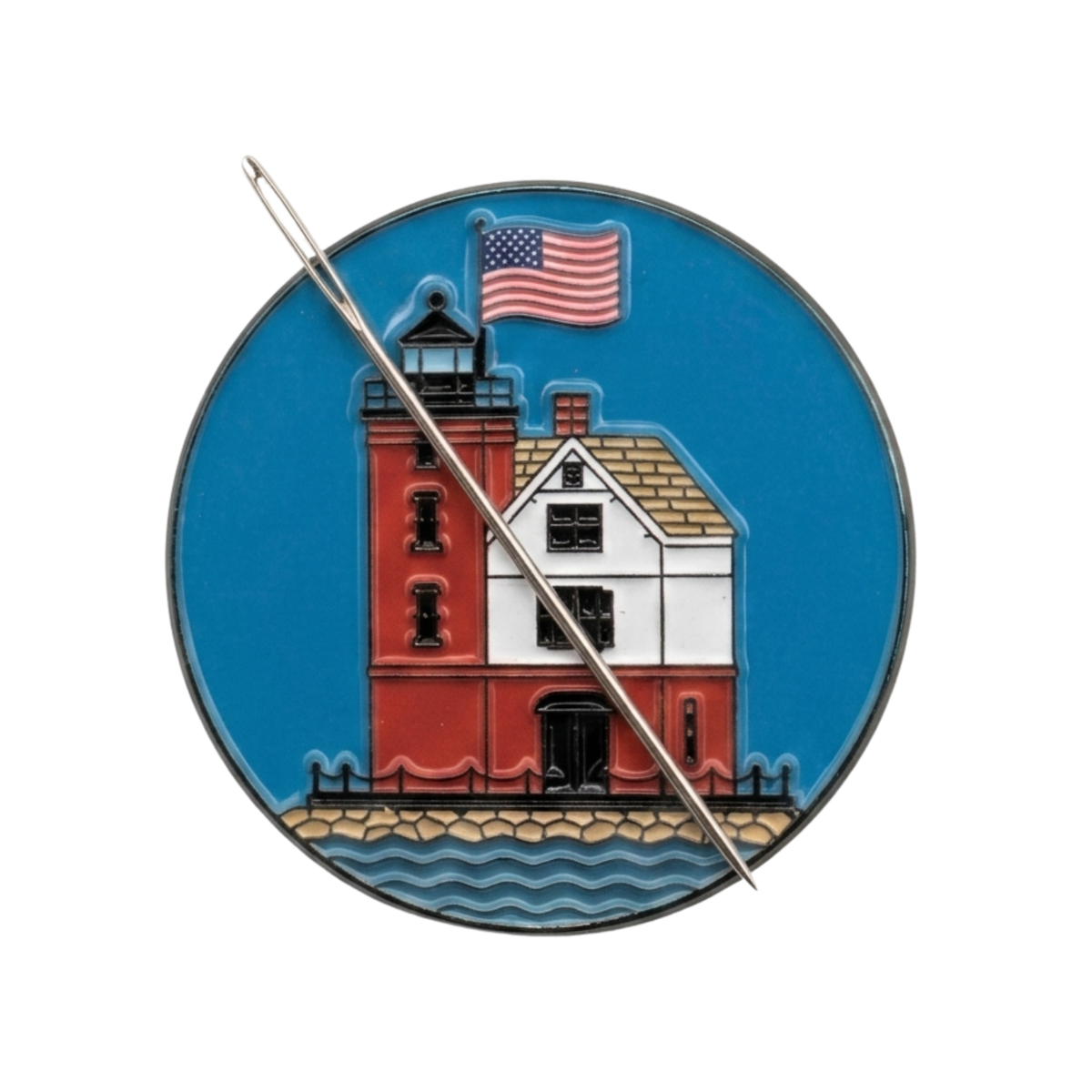 Close up of Round Island Lighthouse enamel needle minder with hard enamel finish and metal edging.