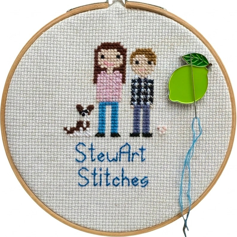Lime needle minder holding a needle on a needlepoint canvas while stitching.