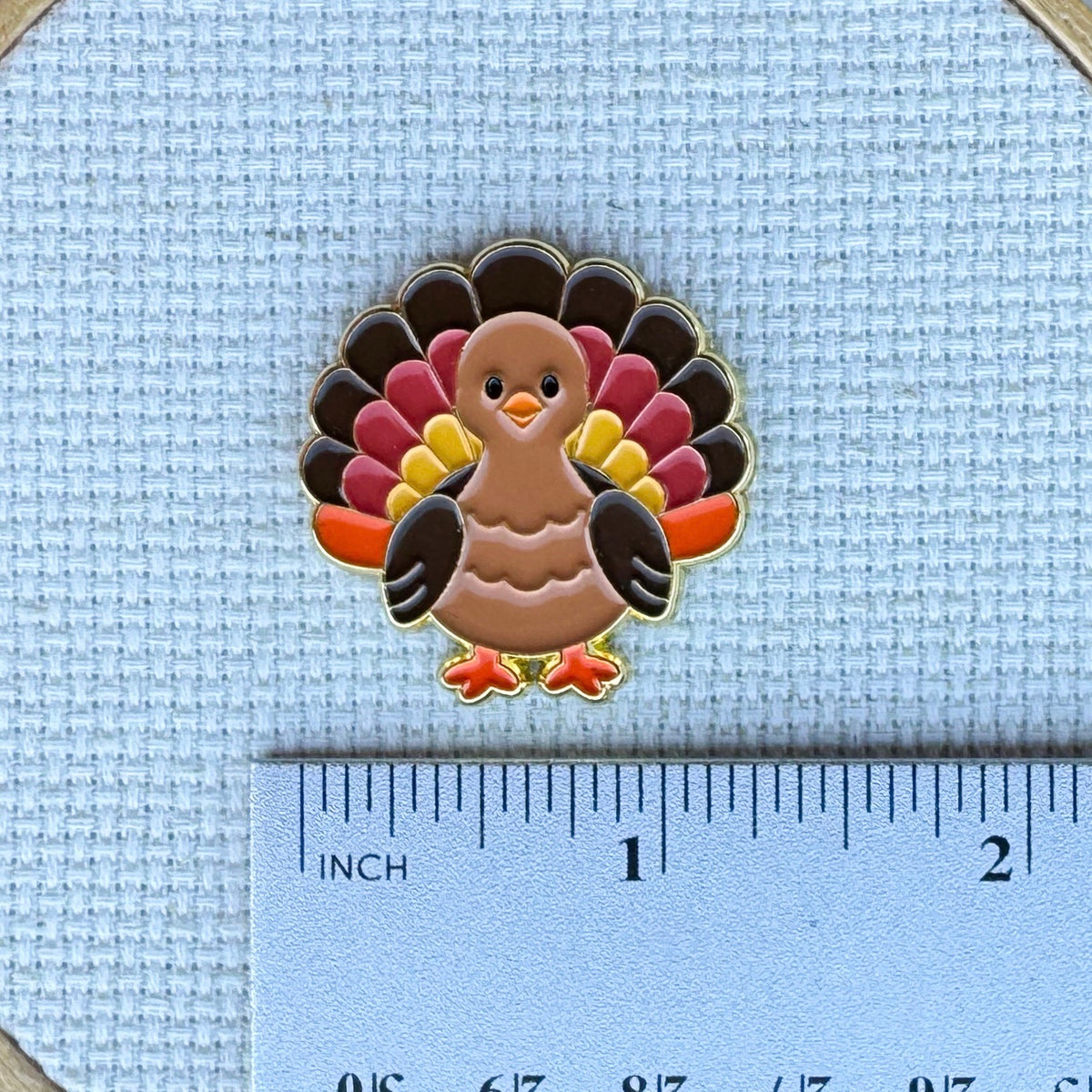 Colorful turkey enamel needle minder. Magnetic needle holder for cross stitch, needlepoint, embroidery, quilting, sewing and other stitching projects.